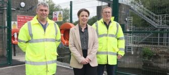 Infrastructure Minister Liz Kimmins pictured with DfI Rivers engineers Mark Scott and Owen McGivern at the Hilden River Control Structure. Picture: FfI